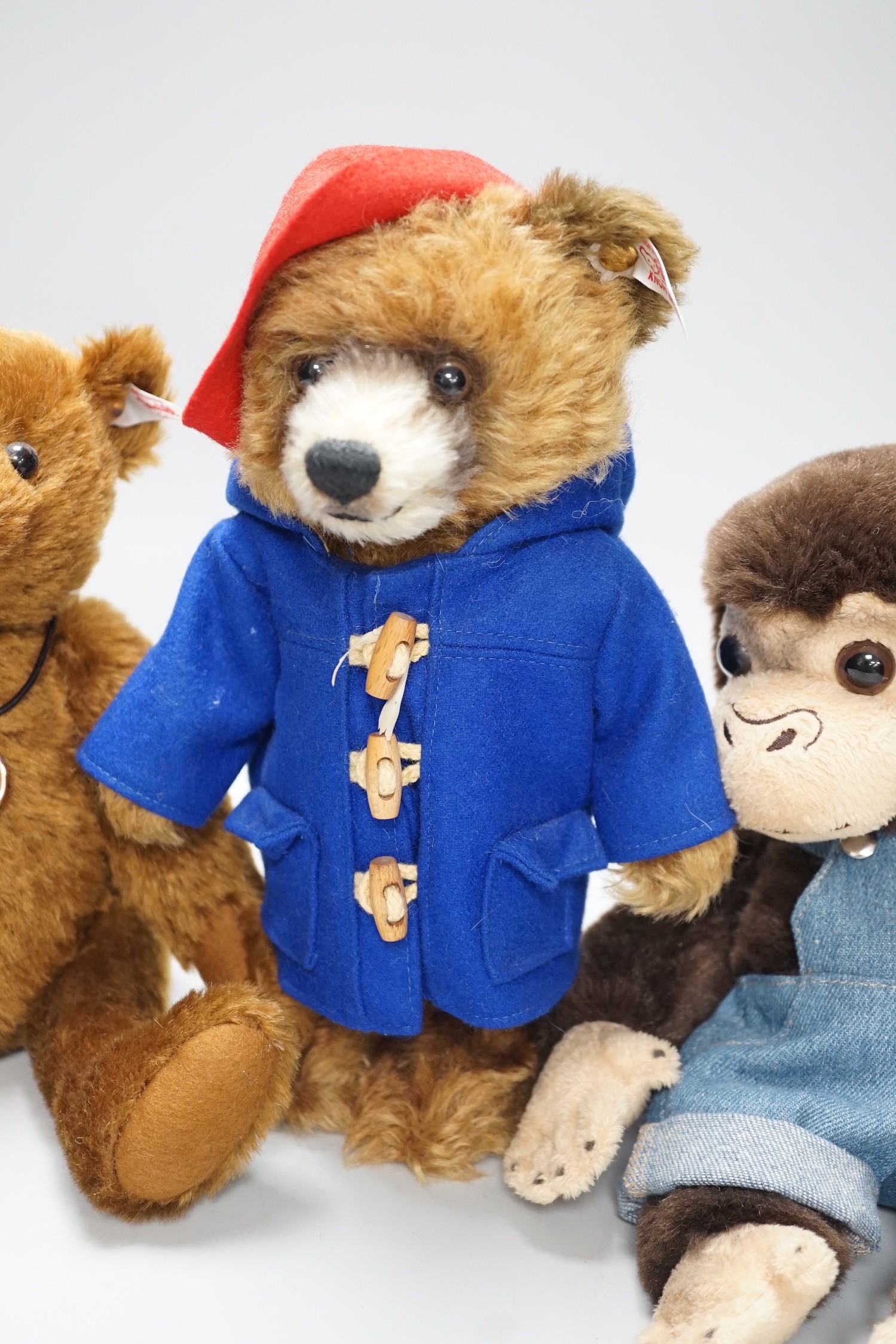 Three boxed Steiff toys: a Paddington bear, a brown bear and a monkey